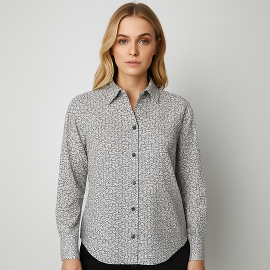 White button-down blouse with black geometric wave print and long sleeves.